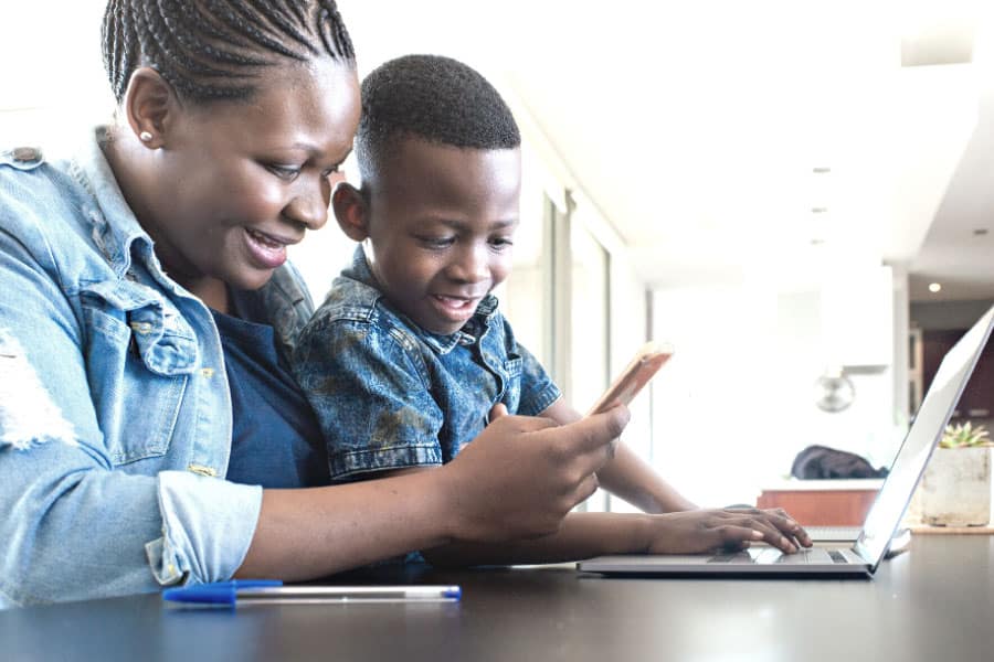 Mom and son looking at phone - You might ask yourself: Am I cut out for homeschooling? In this post I'll give you some tips for gaining homeschooling confidence.